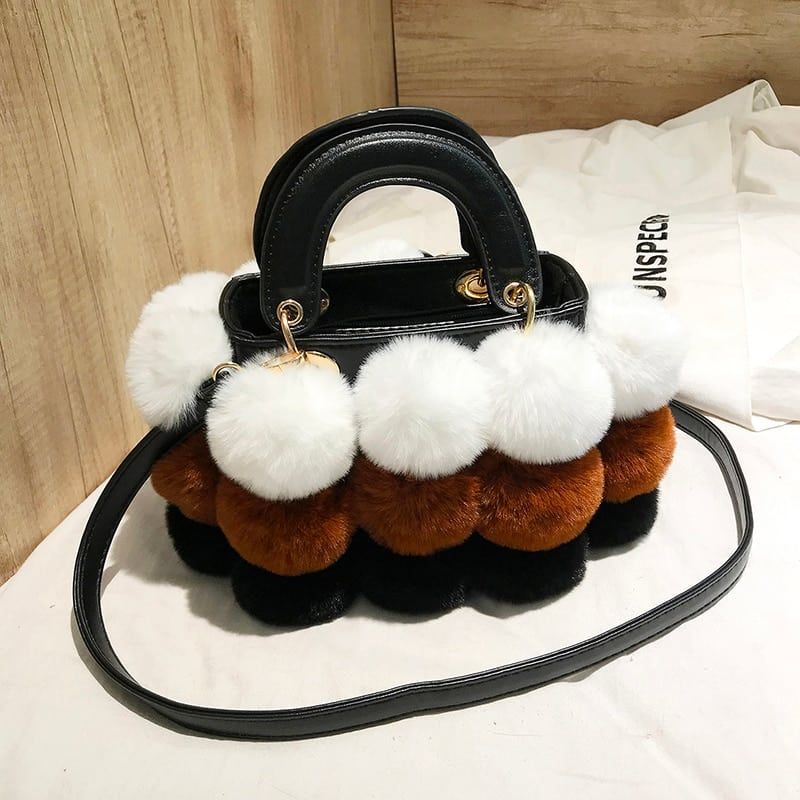 sac à main de voyage en sceau pour femme effet fourrure